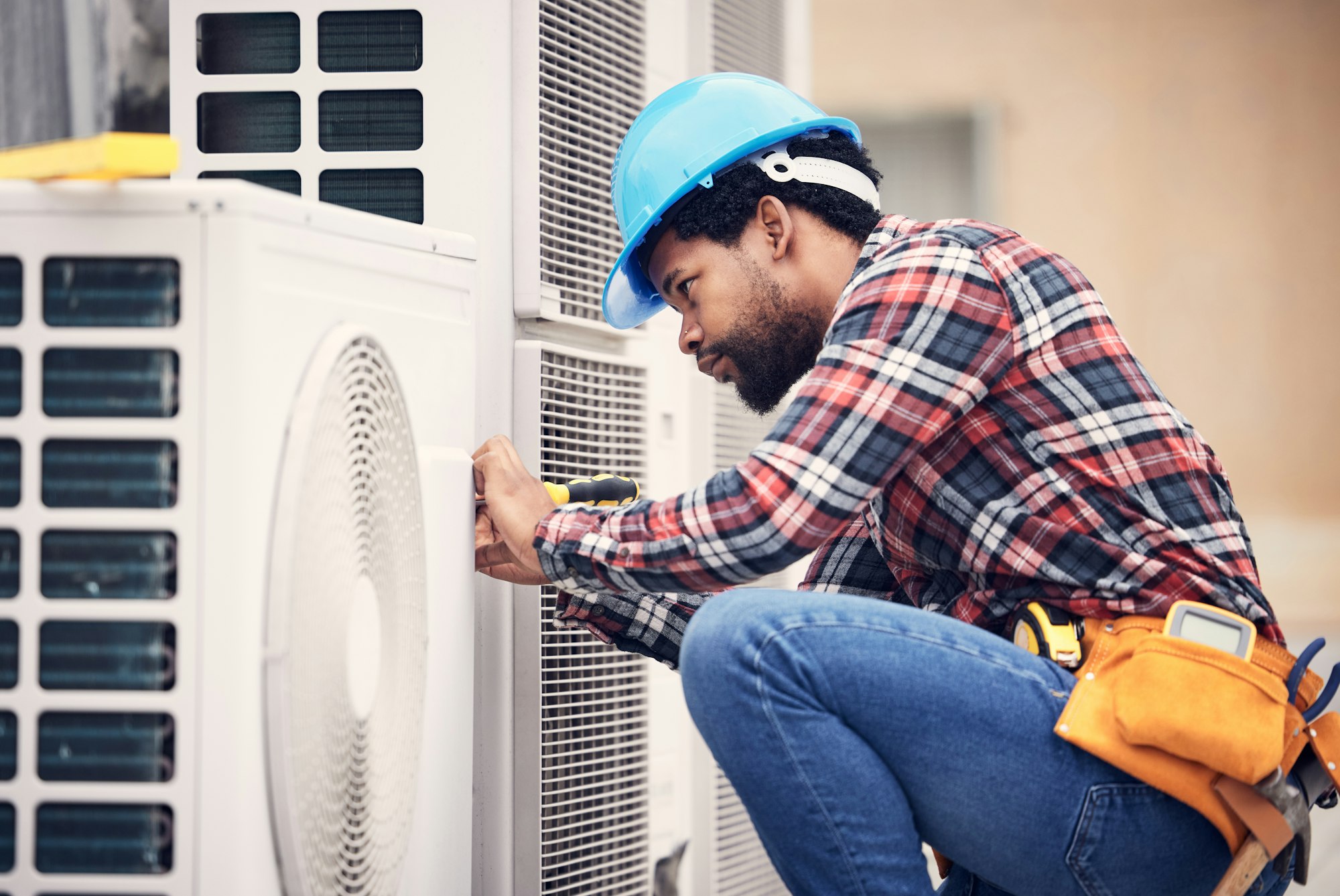 black-man-electrician-and-maintenance-on-air-conditioner-with-engineering-and-handyman-working-wit.jpg